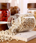 Slick High Borosilicate Glass Storage Jars With Acacia Wood Lids Gonna Keep Your Kitchen Fresh These Dope Food Canisters For Coffee Sugar Nuts Are Straight Up A Nifty Counter Top Setup with spilled grains.