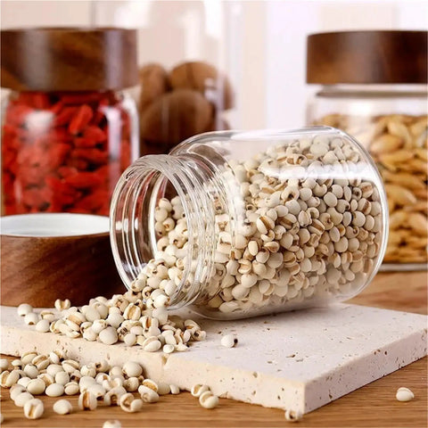 Slick High Borosilicate Glass Storage Jars With Acacia Wood Lids Gonna Keep Your Kitchen Fresh These Dope Food Canisters For Coffee Sugar Nuts Are Straight Up A Nifty Counter Top Setup with spilled grains.