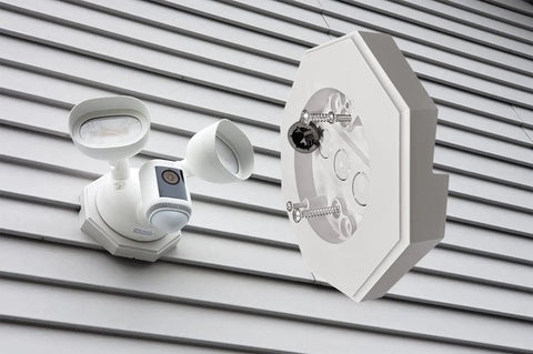 Vertical Siding Lamp Mount Kit with Built-In Box for Lights One Half Inch PVC shown on vertical siding with light fixture.