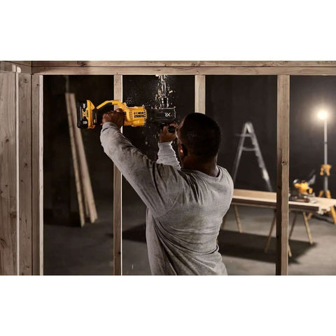 Man using a cordless stud drill for framing work, featuring Power Detect Technology, tough framing tasks.