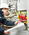 Industrial Lockout Tagout Kit For Electrical Safety With Locks And Clamp On Breaker Locks used by a worker on an electrical panel.