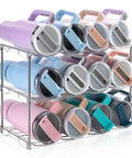Top Shelf Large Water Bottle Organizer Rack Holds Up To Twelve Tumblers With Wide Five Point Nine Gaps And Rugged Handle, showcasing colorful tumblers stacked securely.