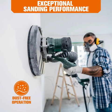 Ditch The Sanding Hassle With This Sweet 84 Piece Set Of Pro Grade 9 Inch Aluminum Oxide Discs Featuring All Seven Essential Grits From Rough To Smooth For Drywall Wood And Paint Projects That Get Your Work Done Fast and Flawless. A worker uses a 9 inch sanding tool on a wall, demonstrating dust-free performance.