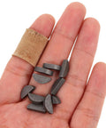 Thinking Process: small grey metal crankshaft key set for two-stroke engines, shown in hand