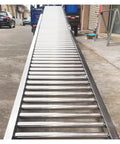 Heavy-Duty Unpowered Gravity Roller Conveyor For Warehouses And Factories, galvanized steel, portable, loading ramp visible.