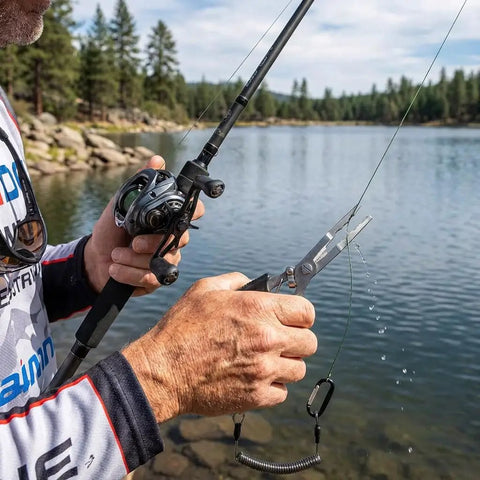 Using 2 Pack Stainless Steel Fishing Pliers With Lanyard, Needle Nose Hook Remover Set near a lake.