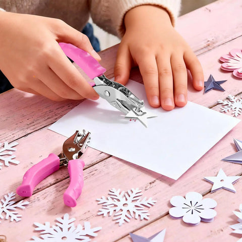 Two Pack Handheld Hole Punches With One Quarter Inch And One Eighth Inch Holes Soft Pink Grip Handy for crafts and scrapbooks on table