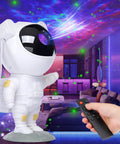 Astronaut-shaped Nebula Night Light Projector for Kids with remote, 8 nebula effects, green stars on wall projection in room.