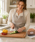 Woman using cutting board with Clear Glass Table Top Slip Proof Pads With Self Adhesive Dots 20mm By 2mm Rubber Bumpers.