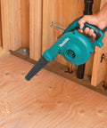 Person using Two In One Blower Vacuum With 145 CFM Air Volume And 203 MPH Air Speed Variable Speed Dial And Trigger For Precise Power.