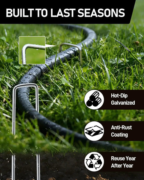 120 Pack Landscape Staples 6 Inch 11 Gauge Galvanized Ground Anchors securing a hose in grass