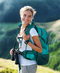 Person wearing 40L Waterproof Hiking Backpack For Outdoor Adventures Go To Ultra Lightweight Daypack in green while hiking in nature.