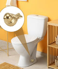 Two Pack Gold Bird Toilet Bolt Covers Decorative Screw Caps Glossy Finish on white toilet in vibrant bathroom.