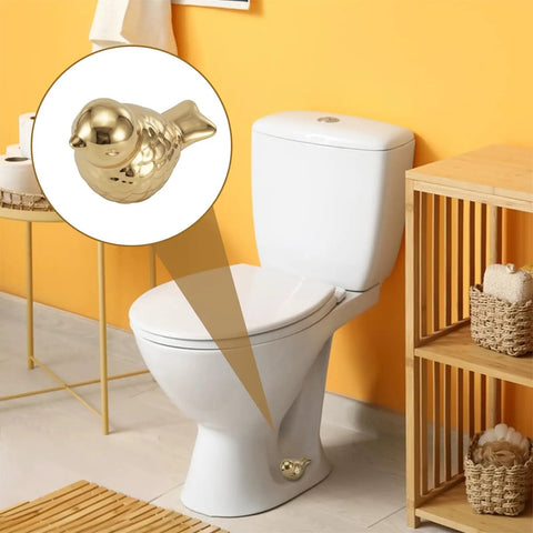Two Pack Gold Bird Toilet Bolt Covers Decorative Screw Caps Glossy Finish on white toilet in vibrant bathroom.