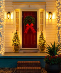 Front porch lit by warm white 300 LED Christmas string lights with clear wire for indoor outdoor use waterproof eight modes including chase effects