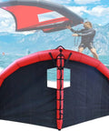 Man using Inflatable Windsurf Board With Foil Hydrofoil And Wing Foil Kit for Kitesurfing And Wind Surfing against mountain backdrop