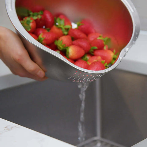 Stainless Steel Rice Washer Strainer Bowl With Agitator Bumps, rust-resistant colander rinsing strawberries over sink, meal prep