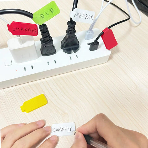 60 Piece Color Coded Cable Labels And Hook And Loop Ties Set For Home Office, applied on cords with handwritten labels.