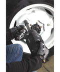 Heavy-Duty Air Impact Wrench With 8 Inch Anvil And D-Handle, 1 Inch Drive in use on a vehicle wheel