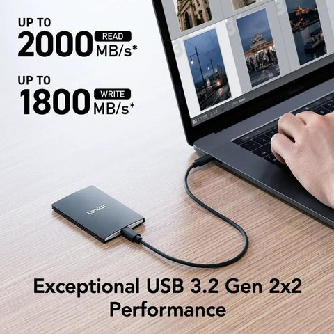 2TB Portable SSD SL500 USB 3.2 Gen 2x2 connected to laptop showing high-speed data transfer