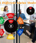 Six Color Coded 6 Inch Black Round Door Sign For Your Work Space Privacy With In A Meeting status shown in an office