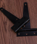24 Pack 4 Inch Black T Shaped Door Hinges Heavy Duty Iron Gate Hinges With 6 Screw Holes on wooden surface