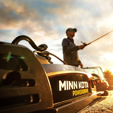 PowerDrive Bow Mount Electric Trolling Motor With GPS Spot Lock shown installed on boat during fishing at sunset