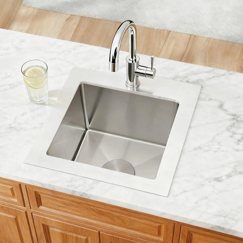 Top view of Drop In Bar Sink 15 By 15 Inch 16 Gauge Stainless Steel for outdoor wet bar and RV, installed on marble countertop.