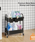 Two Tier Rolling Cart With Wheels Heavy Duty Metal Storage Organizer On Casters For Office Kitchen Craft Room Or Under Desk Trolley Small Utility Carts For Tools And Supplies Black holding laundry items against a wall.