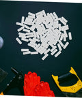 Professional Grade Furniture Hidden Connectors For Shelf Assembly Fasteners spread across a black surface with tools.