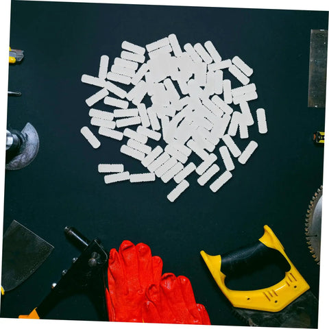 Professional Grade Furniture Hidden Connectors For Shelf Assembly Fasteners spread across a black surface with tools.