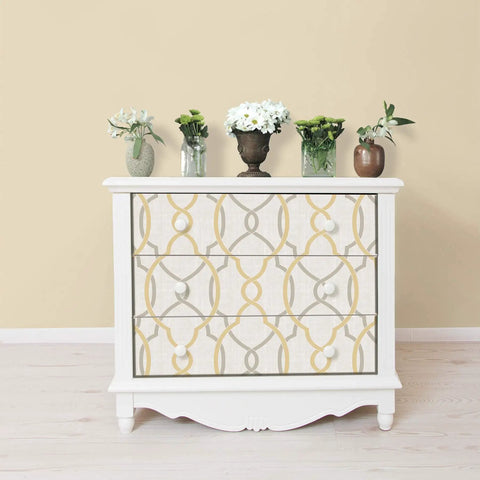 Peel and Stick Wallpaper Sausalito Taupe Yellow Linen Texture Removable on cabinet with white flowers, smooth surfaces.
