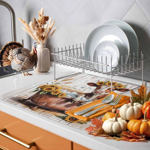 Fall Thanksgiving Sunflower Cow Themed Dish Drying Mat on kitchen counter with pumpkins, turkey, and plates