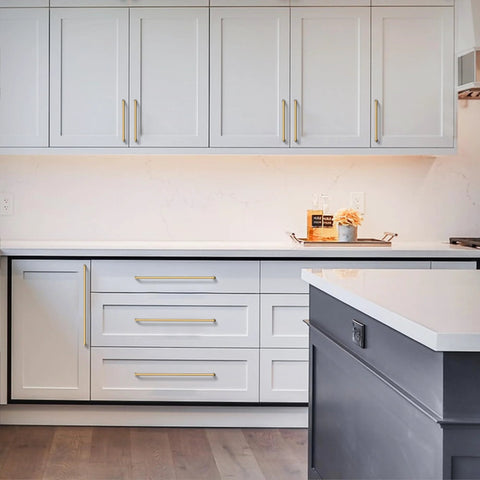 Champagne Bronze Cabinet Pulls 10 Pack 5 Inch Center To Center 128mm installed on white kitchen cabinets and drawers.