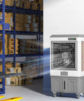 Heavy Duty Industrial Evaporative Air Cooler And Swamp Cooling Fan With 26 Gallon Water Tank in a warehouse cooling the area.