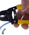 Hella Versatile Data T Cutter Wire Tool For Structured Networks And Coax Cables Up To Rg 11 held in hand, cutting blue coax cables.