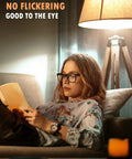 Woman reading under A19 3 Way LED Light Bulb 400 Lumens, 900 Lumens, 1300 Lumens Soft White 3000K for reading and bedside lamps.