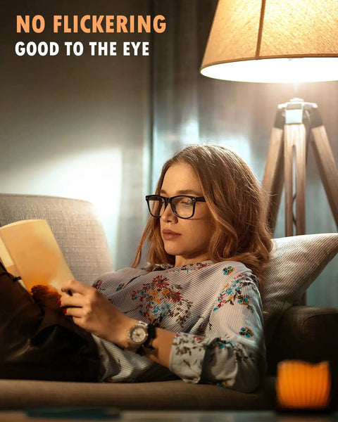 Woman reading under A19 3 Way LED Light Bulb 400 Lumens, 900 Lumens, 1300 Lumens Soft White 3000K for reading and bedside lamps.