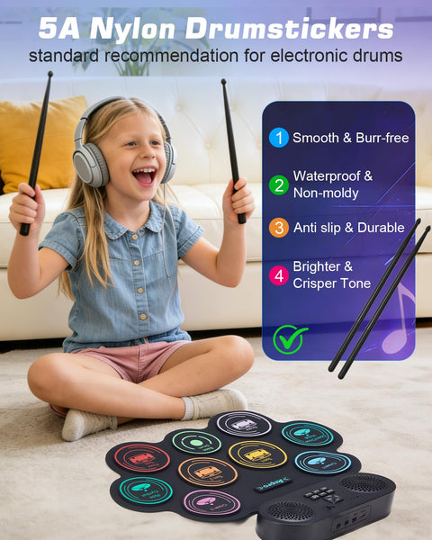 Girl playing Portable Roll Up Electric Drum Kit With 9 Pads And Dual Stereo Speakers Bluetooth MIDI Practice Ready For Kids And Adults Beginners Includes Pedals Sticks And Headphone Support, smiling with headphones and sticks.