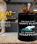 Sailor Coffee Mug 11oz Black For Boaters And Boat Captains Funny Lake And Sailboat Gift On The Go Morning Brew For Him Or Her Great Gift For Sailors Sea Lovers Lake Life Fans with quote 'The Sea Is My Happy Place' next to splash of coffee