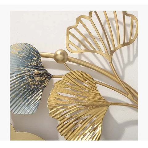 Close-up of Modern Wall Mounted Coat Rack Featuring Five Sturdy Metal Hooks, showcasing detailed metal leaves and gold accents.