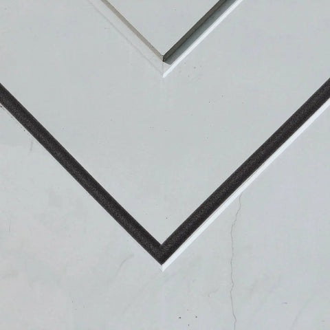 Top Shelf Black Foam Backer Rod And Gap Filler For Expansion Joints And Cracks used in masonry joint sealing on white surface.