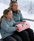 Super Cute Plush Bunny Shape Hand Warmer Muff Pillow That Locks In Heat For Winter Chill Days Without Electricity in use on a ski lift.
