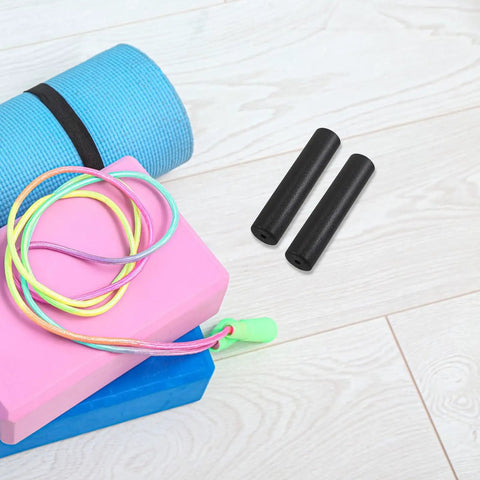 4 Pack Fitness Handle Grips For Barbells And Free Weights With Anti Slip Plastic Covers on gym floor