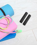 4 Pack Dumbbell Grips With Ergonomic Design For Non Slip Plastic Weight Lifting Handles on wooden floor near workout gear