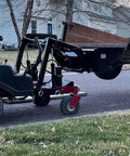 Heavy Duty 42 Inch Mini Skid Steer Dirt Bucket Attachment With Toro Style Mounting in use on driveway