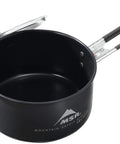 Go To Solo Camping Pot 1.3 Liter With Nonstick Ceramic Fusion Coating Lightweight Aluminum Cook Pot For Easy Solo Meals Scratch Resistant PTFE And PFOA Free High Temperature Safe Easy To Clean Lid Included showing open pot with handle and lid slightly ajar