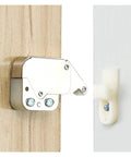 Cool Push To Open Touch Latches Make Handleless Cupboards A Breeze with spring catch mechanism on wood and white cabinet.