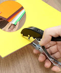 Beefy Built To Last Handheld Hole Punch 8mm Five Sixteenth Inch punching yellow paper on wooden desk