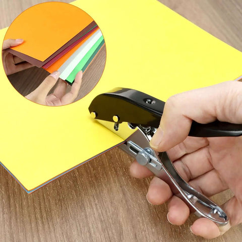 Beefy Built To Last Handheld Hole Punch 8mm Five Sixteenth Inch punching yellow paper on wooden desk